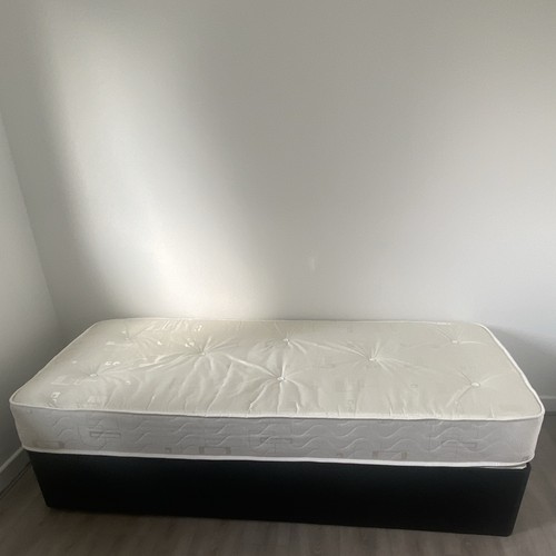 Single size black bed with - with,